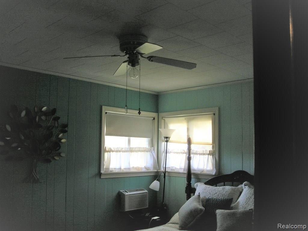 130 West Capac Road Imlay City, MI 48444 - Photo 9 of 20 Master bedroom with room AC and ceiling fan