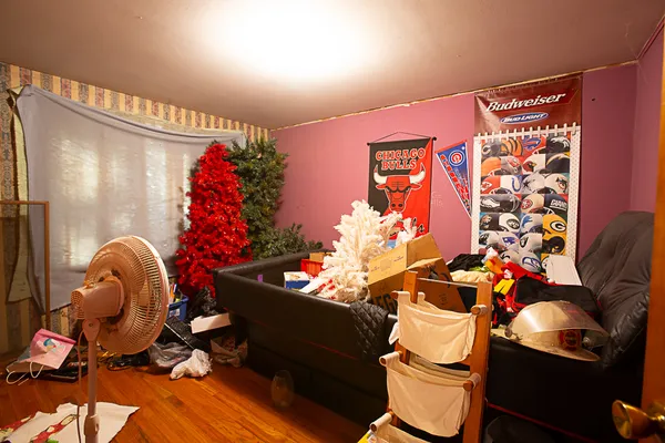 a bedroom with furniture and a flat screen tv