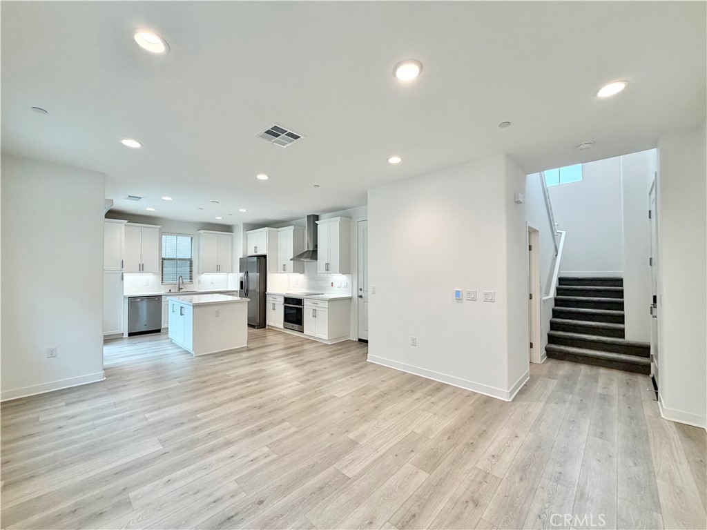 26893 Rubicon Road Menifee, CA 92586 - Photo 6 of 32 a view of a kitchen with wooden floor