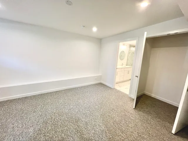 an empty room with a empty space and a sink