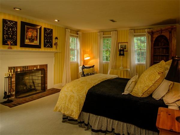 8 Stratton Drive Westborough, MA 01581 - Photo 15 of 30 a bedroom with a bed and a fireplace