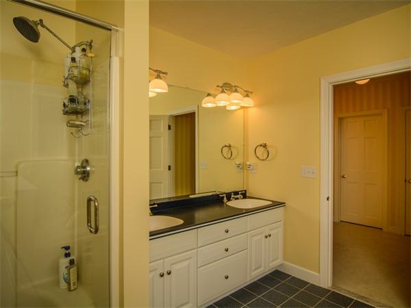 8 Stratton Drive Westborough, MA 01581 - Photo 16 of 30 a bathroom with a granite countertop sink a mirror a shower and a mirror
