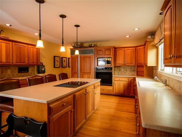 8 Stratton Drive Westborough, MA 01581 - Photo 8 of 30 a kitchen with stainless steel appliances granite countertop a sink a stove and a wooden floors