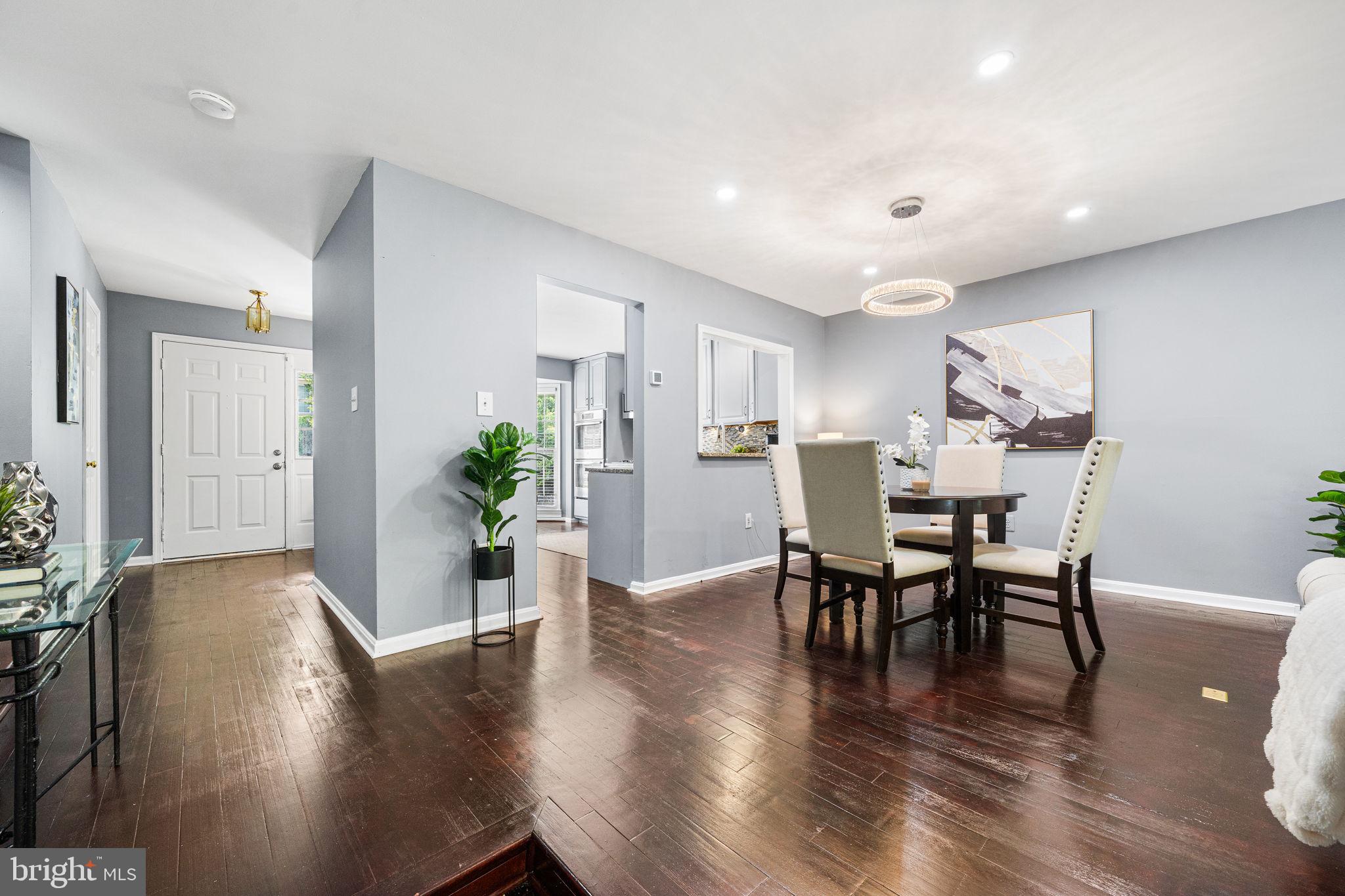 7403 Ridge Oak Court Springfield, VA 22153 - Photo 16 of 54 a view of a dining room with furniture and wooden floor