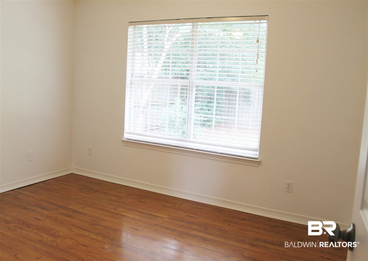 8522 Southern Oak Court Mobile, AL 36695 - Photo 15 of 21 Light and airy with a view of the backyard.