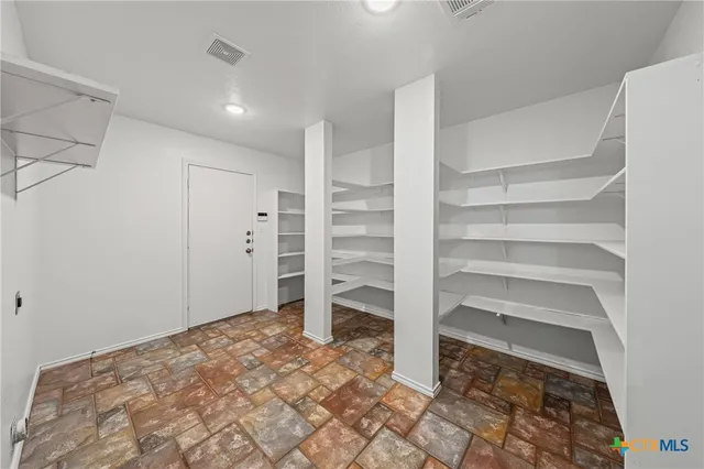 a bedroom with a bed and a closet