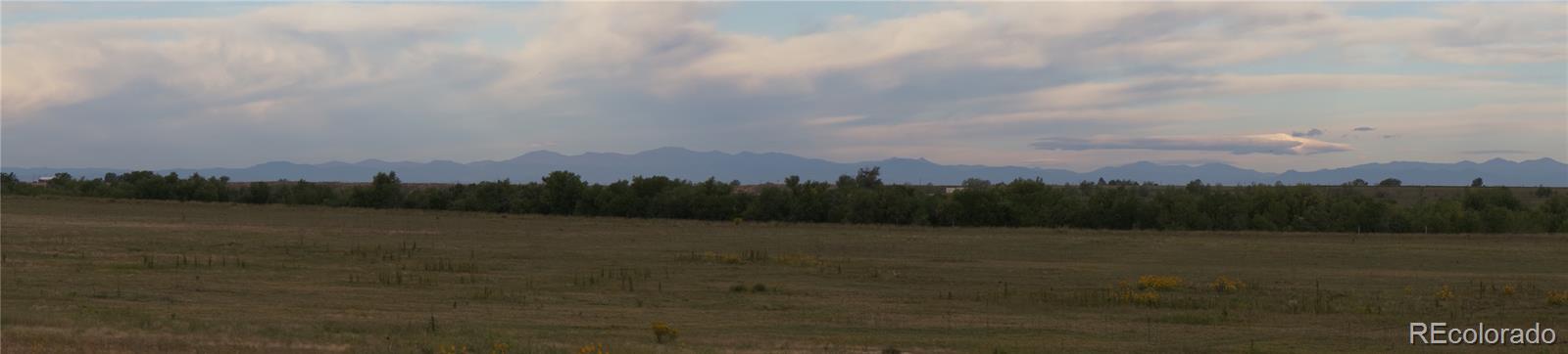 6955 Yulle Road Bennett, CO 80102 - Photo 13 of 16 a view of mountain with lake view