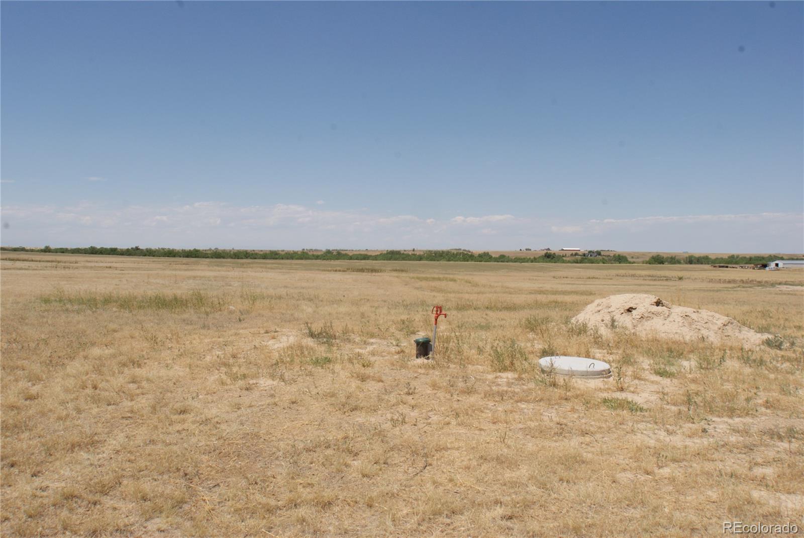 6955 Yulle Road Bennett, CO 80102 - Photo 6 of 16 a view of an ocean and beach