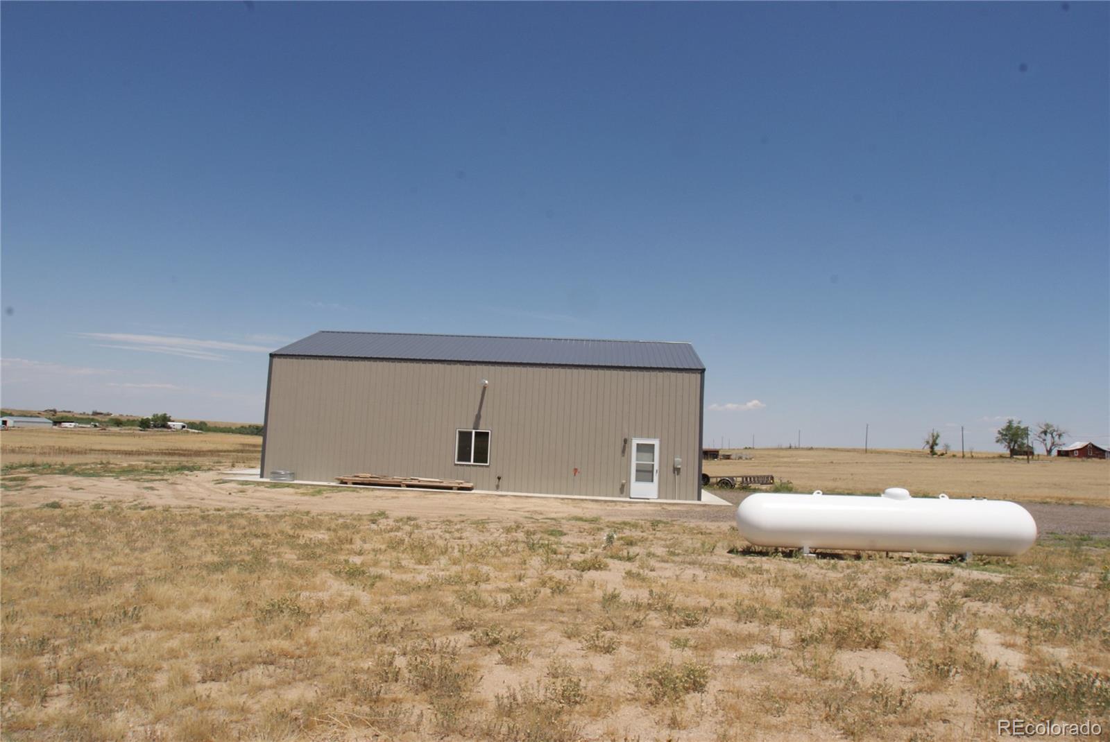6955 Yulle Road Bennett, CO 80102 - Photo 8 of 16 a bathroom with a sink