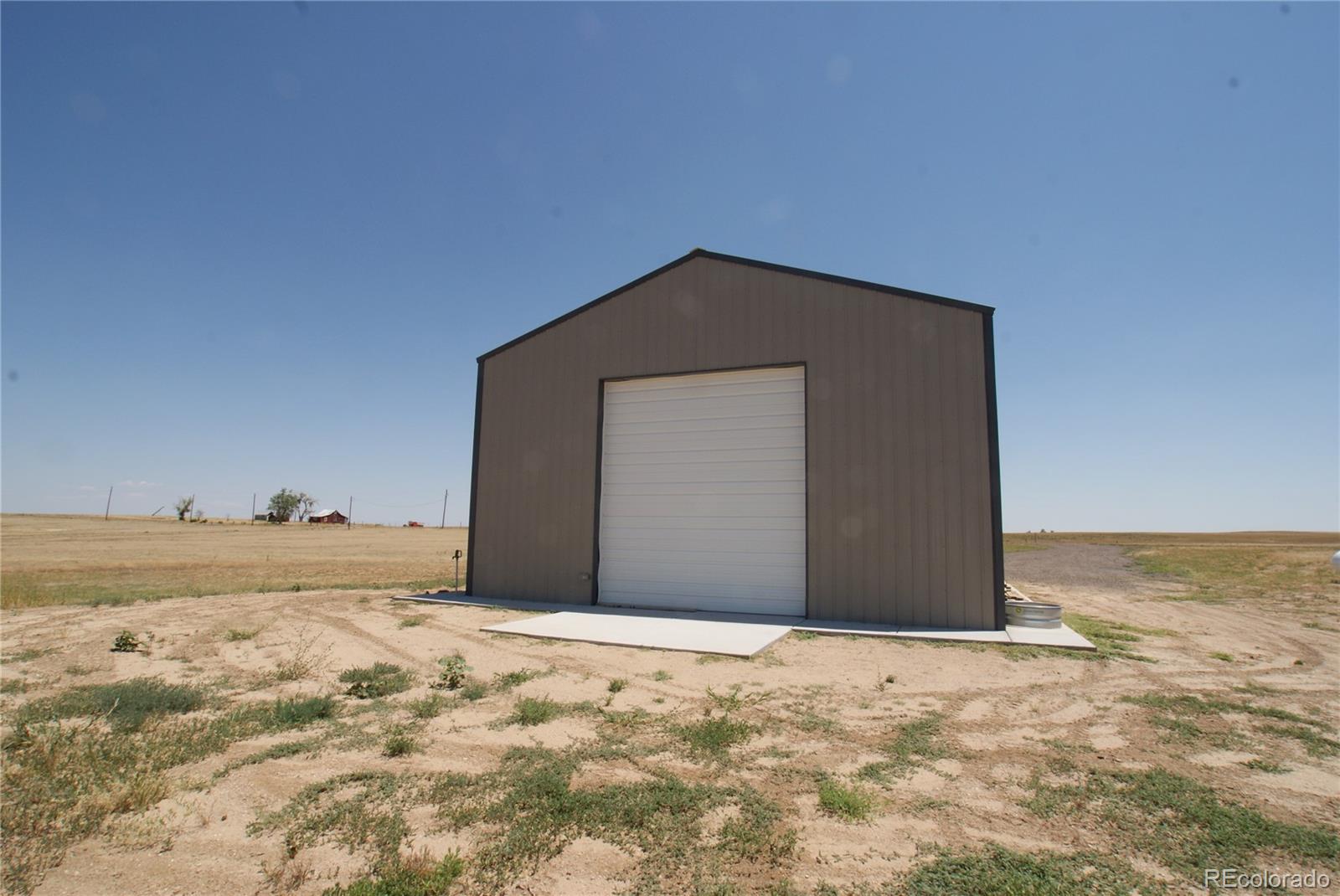 6955 Yulle Road Bennett, CO 80102 - Photo 9 of 16 a house with a outdoor space