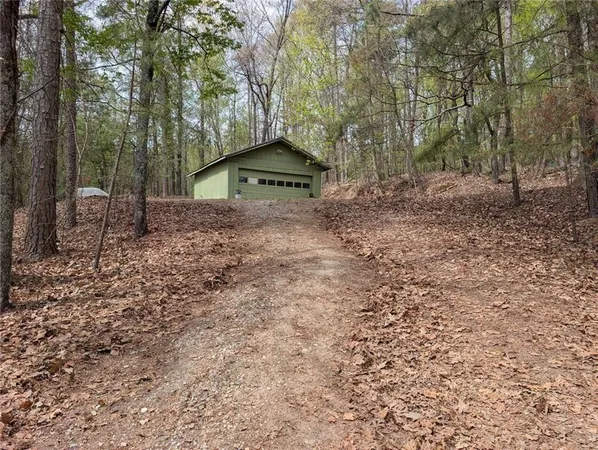 a view of a house with yard and tree s