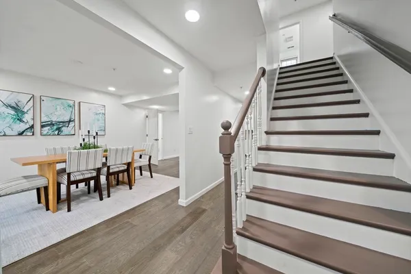 a view of dining room with furniture and wooden floor