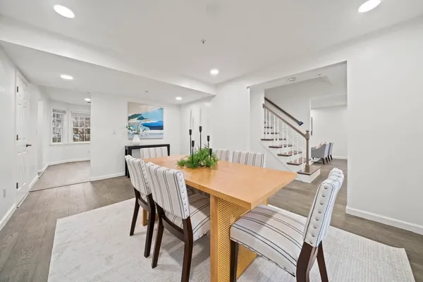 a view of a dining room with furniture and wooden floor
