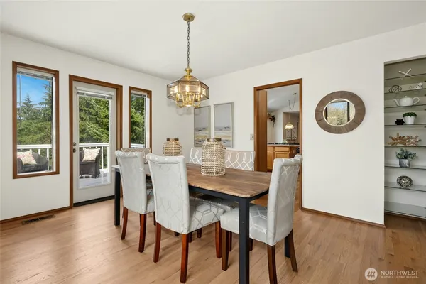 a view of a dining room with furniture window and wooden floor