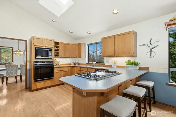 a kitchen with a table and chairs in it