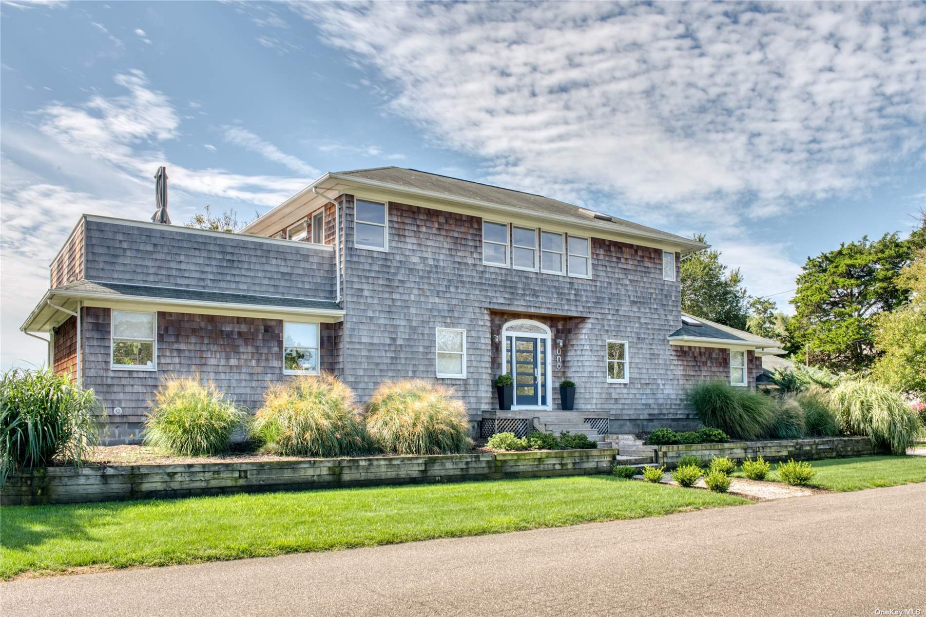 1 Duck Point Road Remsenburg, NY 11960 - Photo 1 of 1 a front view of a house with a yard and garage