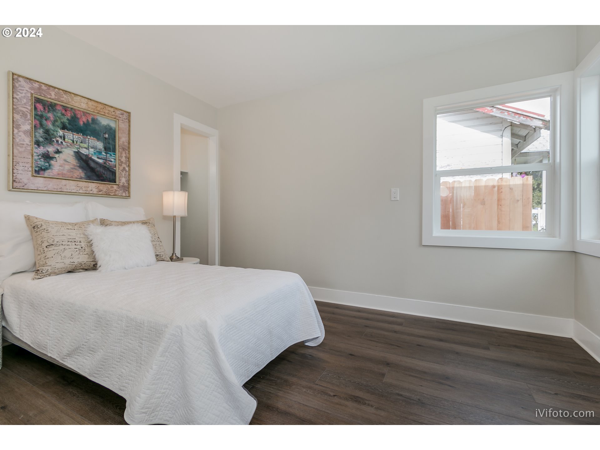 140 South 15th Street Springfield, OR 97477 - Photo 14 of 27 a bedroom with a bed and a painting on the wall