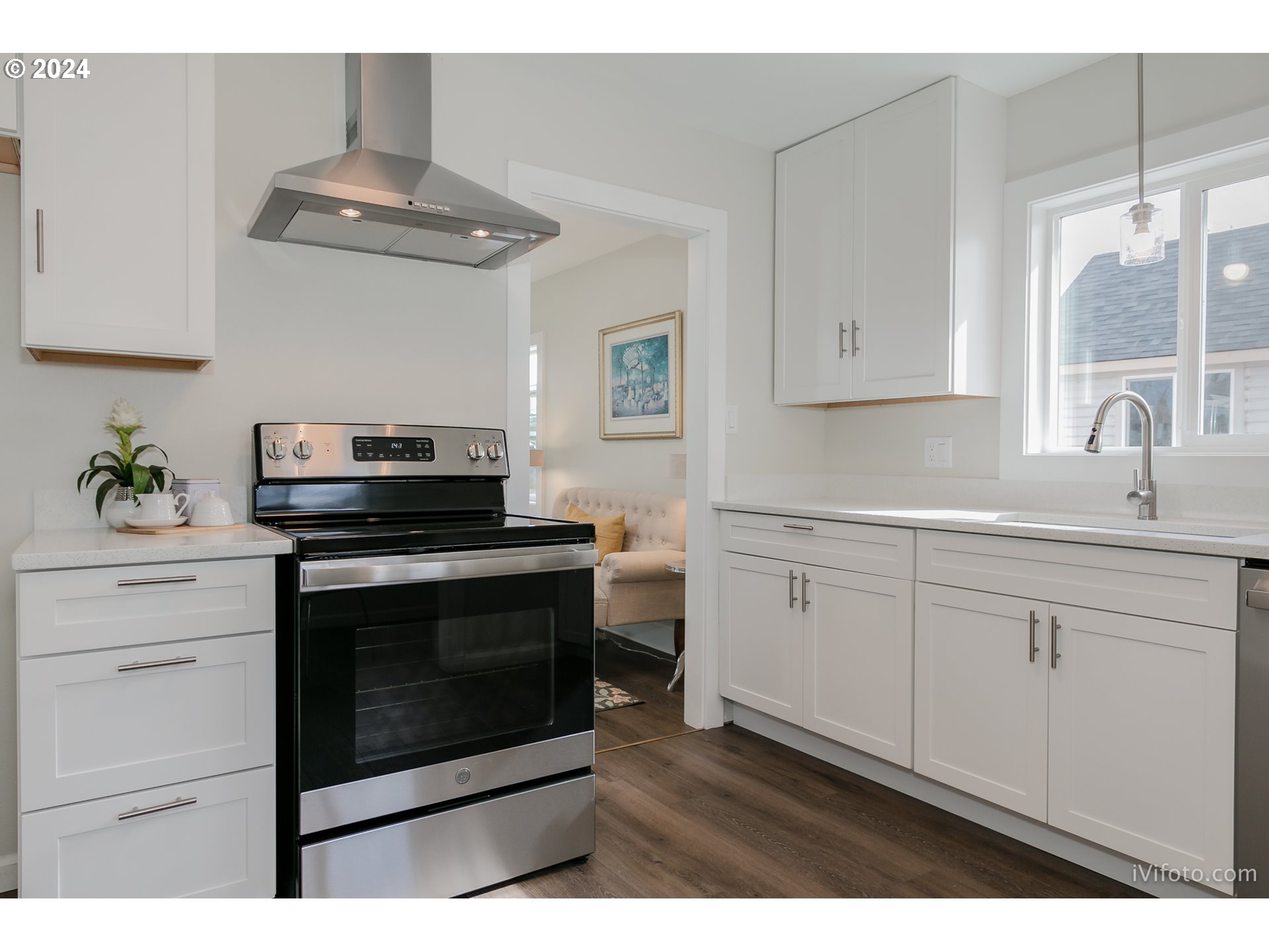 140 South 15th Street Springfield, OR 97477 - Photo 9 of 27 a kitchen with white cabinets stainless steel appliances and sink