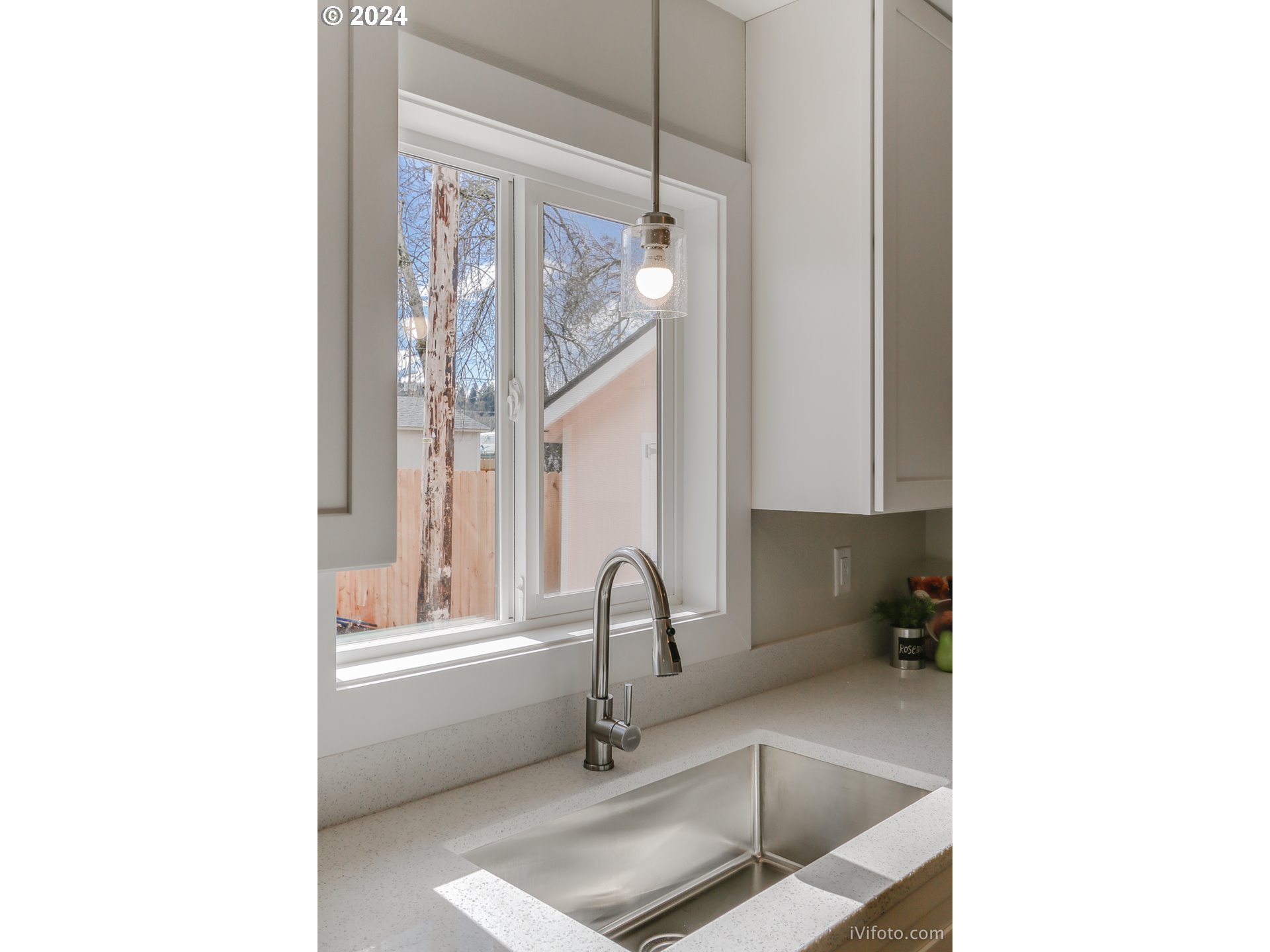 140 South 15th Street Springfield, OR 97477 - Photo 10 of 27 a kitchen with a sink and a window