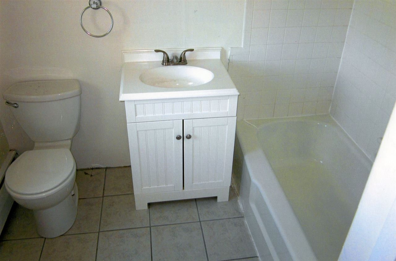4940 Spring Hill Road Mount Solon, VA 22843 - Photo 17 of 44 a bathroom with a sink toilet and vanity