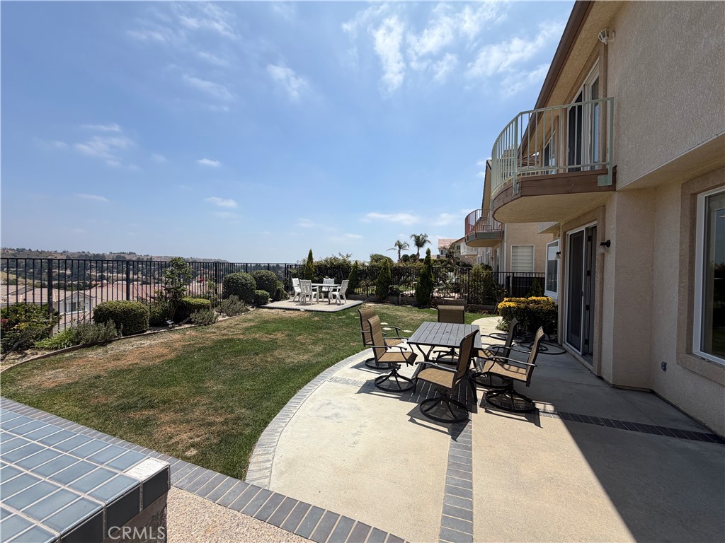 19823 Mariposa Pines Way Porter Ranch, CA 91326 - Photo 4 of 50 a view of a patio with chair and tables