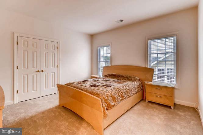 10849 Nimrod Road Perry Hall, MD 21128 - Photo 22 of 26 a bedroom with a bed and a cabinets