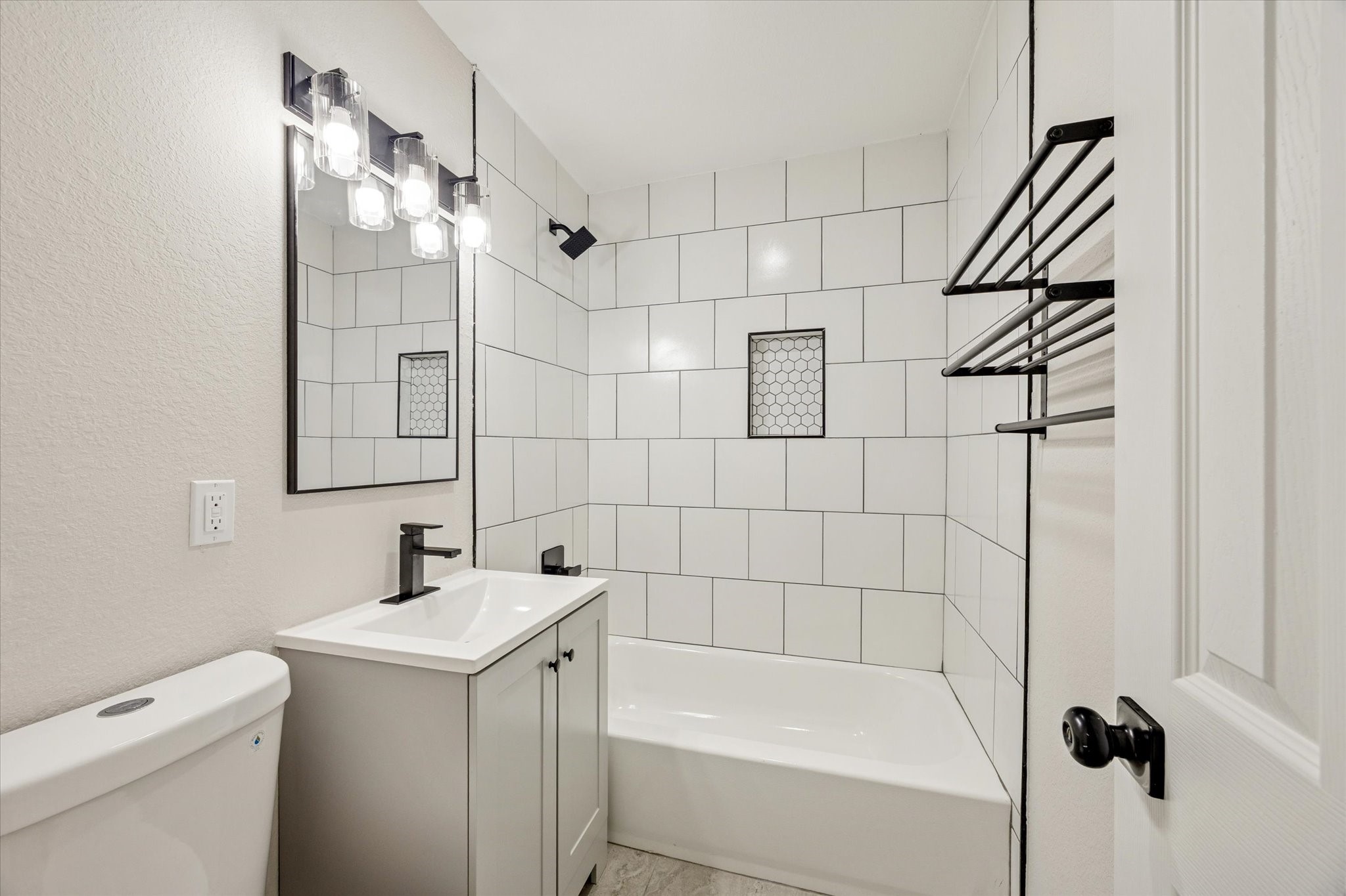 6731 London Street Houston, TX 77021 - Photo 9 of 11 a bathroom with a sink a toilet and shower