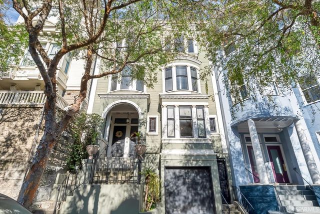 a front view of a house with large windows
