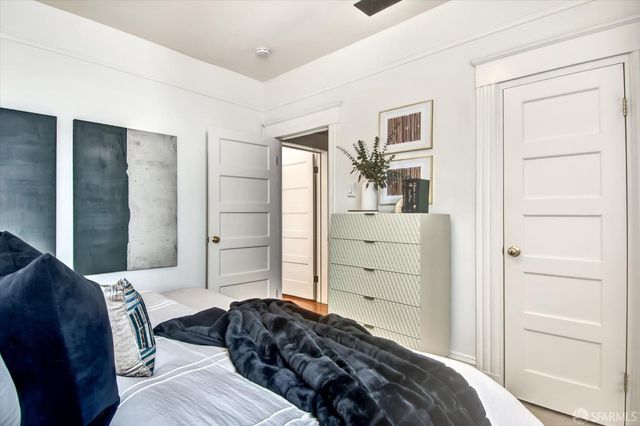 a bedroom with a bed and a closet