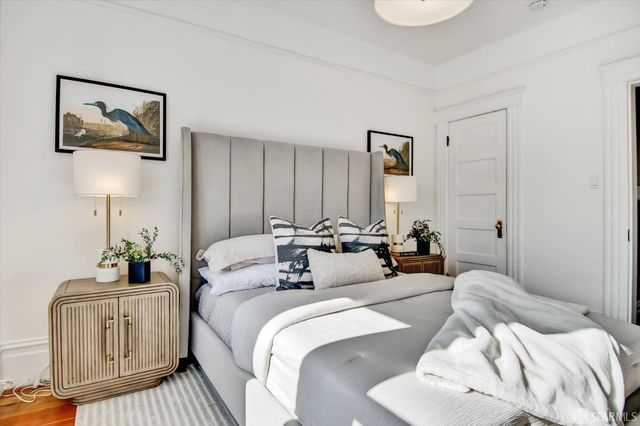 a living room with furniture and a mirror