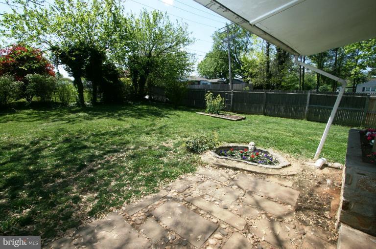 1001 Hartmont Road Catonsville, MD 21228 - Photo 14 of 29 a view of a chair and fire pit in the backyard