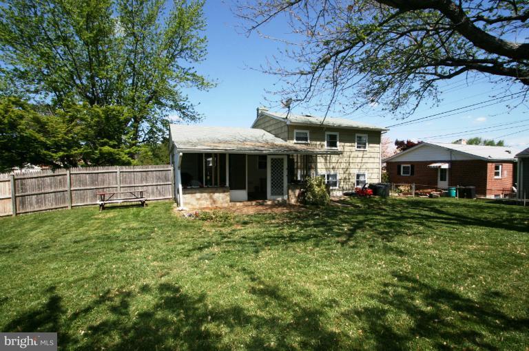 1001 Hartmont Road Catonsville, MD 21228 - Photo 15 of 29 a front view of a house with a garden