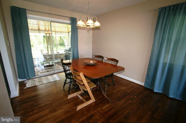 1001 Hartmont Road Catonsville, MD 21228 - Photo 16 of 29 a view of a dining room with furniture window and wooden floor
