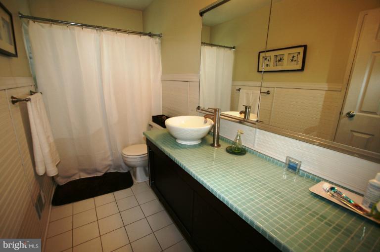 1001 Hartmont Road Catonsville, MD 21228 - Photo 18 of 29 a bathroom with a sink a toilet and shower
