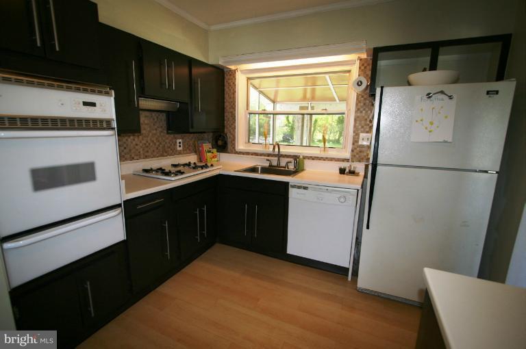 1001 Hartmont Road Catonsville, MD 21228 - Photo 19 of 29 a kitchen with a refrigerator a sink and a stove