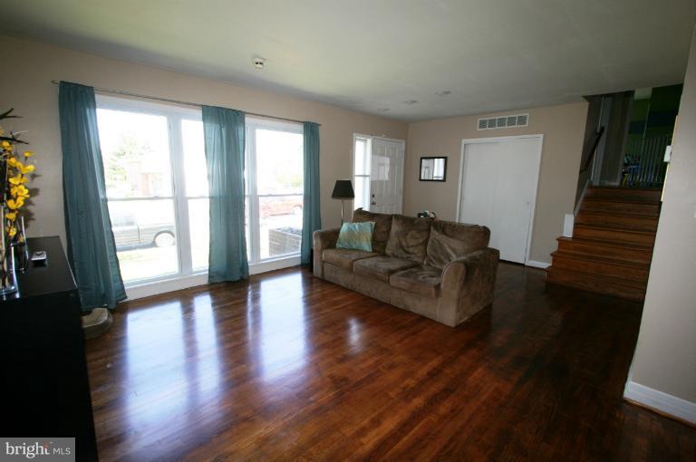1001 Hartmont Road Catonsville, MD 21228 - Photo 3 of 29 a living room with furniture and a wooden floor