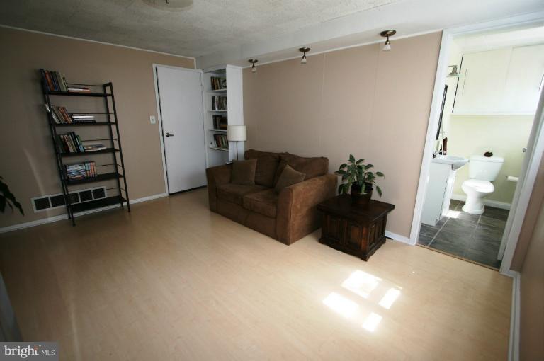 1001 Hartmont Road Catonsville, MD 21228 - Photo 23 of 29 a living room with furniture and a flat screen tv