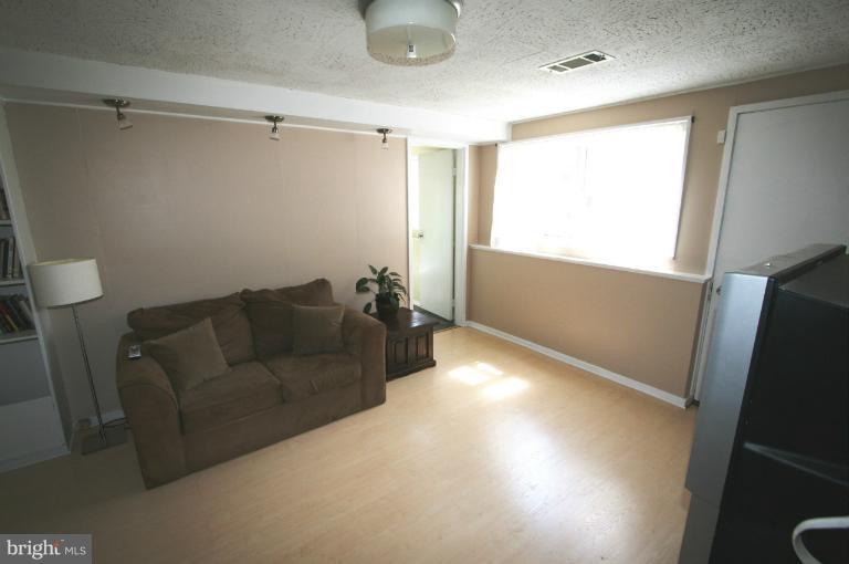 1001 Hartmont Road Catonsville, MD 21228 - Photo 24 of 29 a living room with furniture and a window