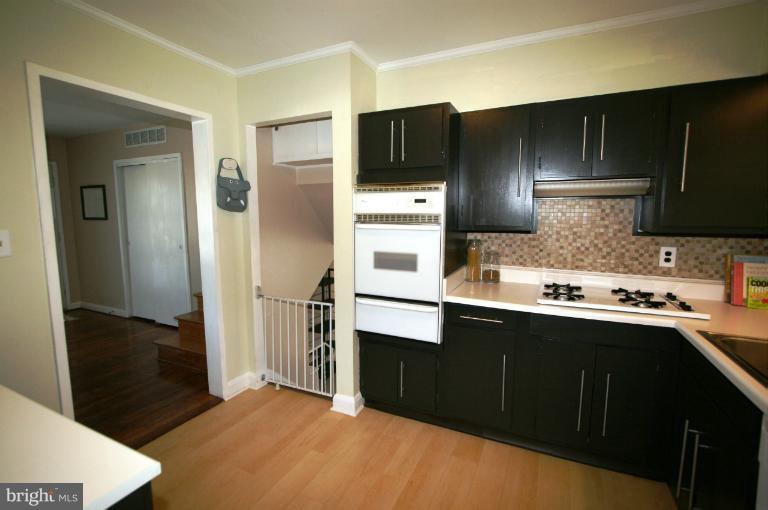1001 Hartmont Road Catonsville, MD 21228 - Photo 26 of 29 a kitchen with granite countertop a refrigerator and a sink