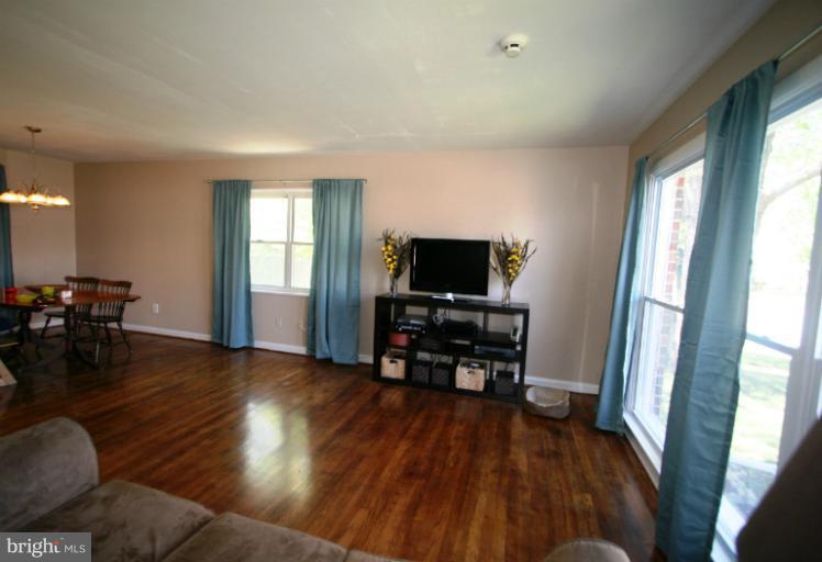 1001 Hartmont Road Catonsville, MD 21228 - Photo 28 of 29 a living room with furniture and a flat screen tv