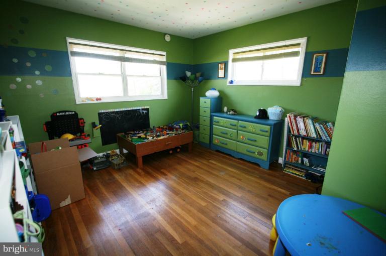 1001 Hartmont Road Catonsville, MD 21228 - Photo 5 of 29 a room with furniture and a wooden floor