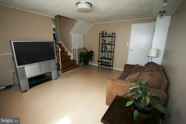 1001 Hartmont Road Catonsville, MD 21228 - Photo 7 of 29 a living room with furniture and a flat screen tv