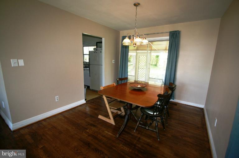 1001 Hartmont Road Catonsville, MD 21228 - Photo 9 of 29 a view of a dining room with furniture window and wooden floor