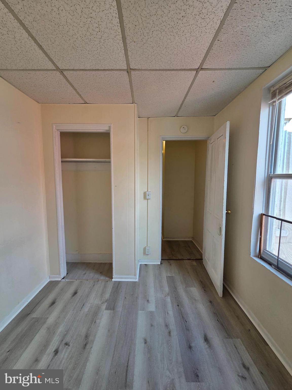 1712 Perkiomen Avenue Reading, PA 19602 - Photo 14 of 20 an empty room with wooden floor and windows