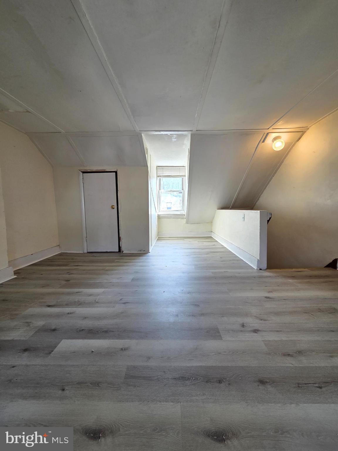 1712 Perkiomen Avenue Reading, PA 19602 - Photo 16 of 20 a view of an empty room with wooden floor and a window