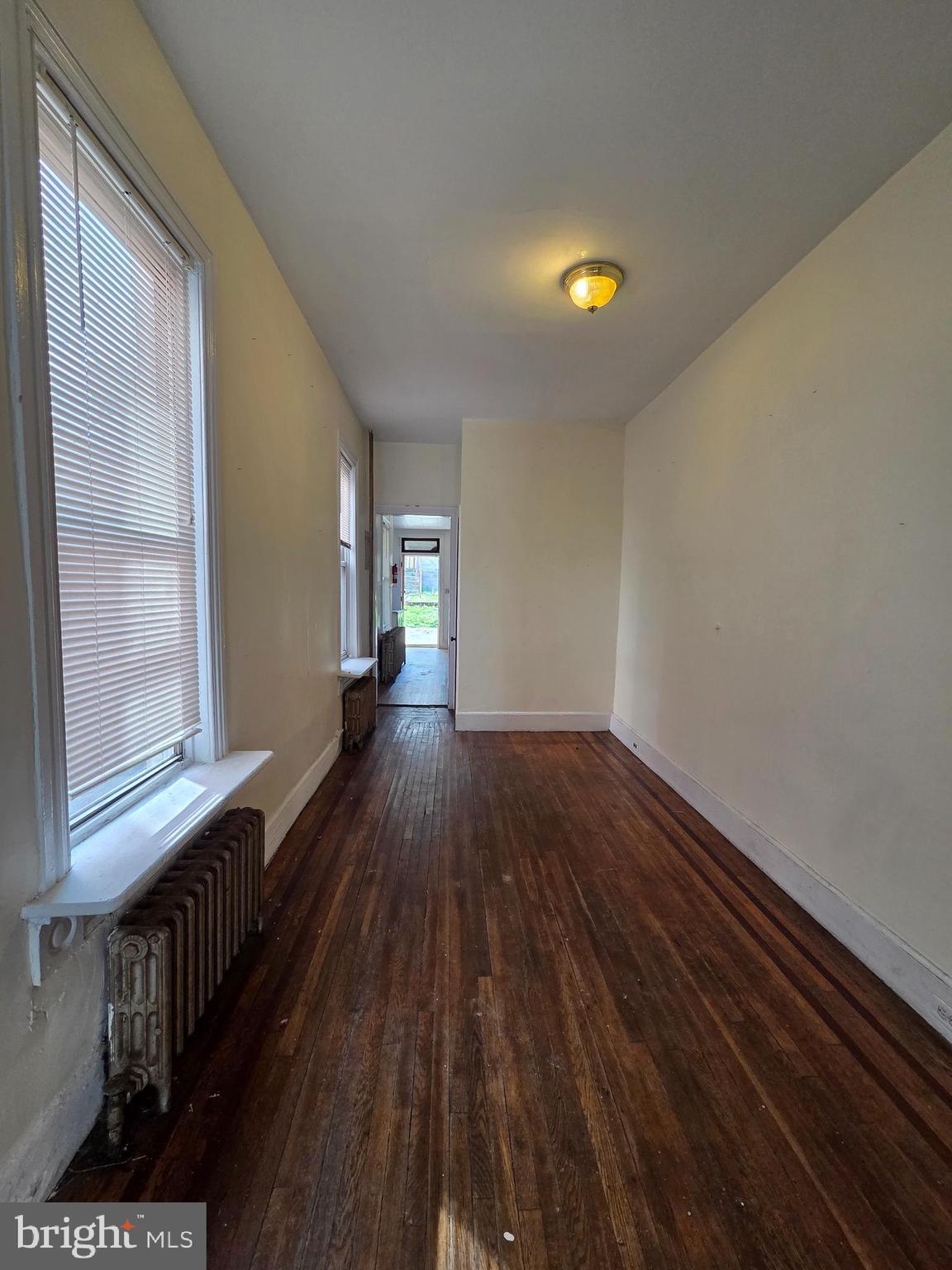 1712 Perkiomen Avenue Reading, PA 19602 - Photo 6 of 20 a view of a room with wooden floor and staircase