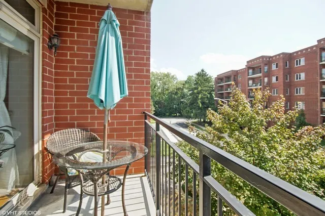 a balcony view with a outdoor seating space