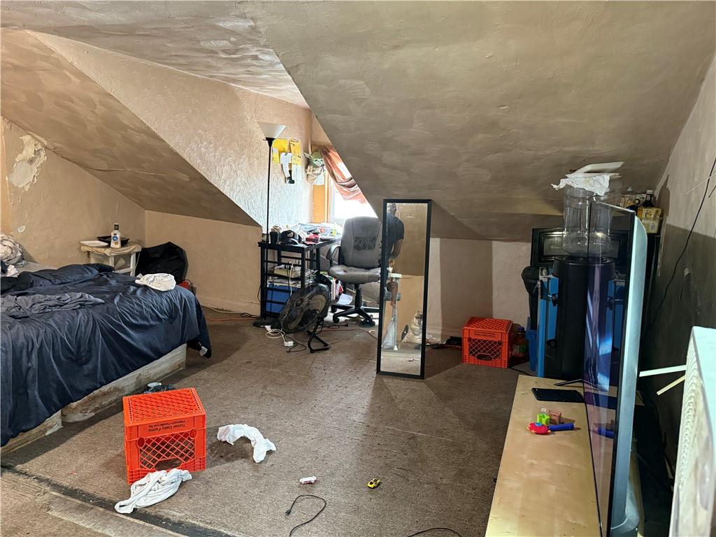 117 Charles Street Pittsburgh, PA 15210 - Photo 13 of 17 a gym room with lots of furniture and equipment