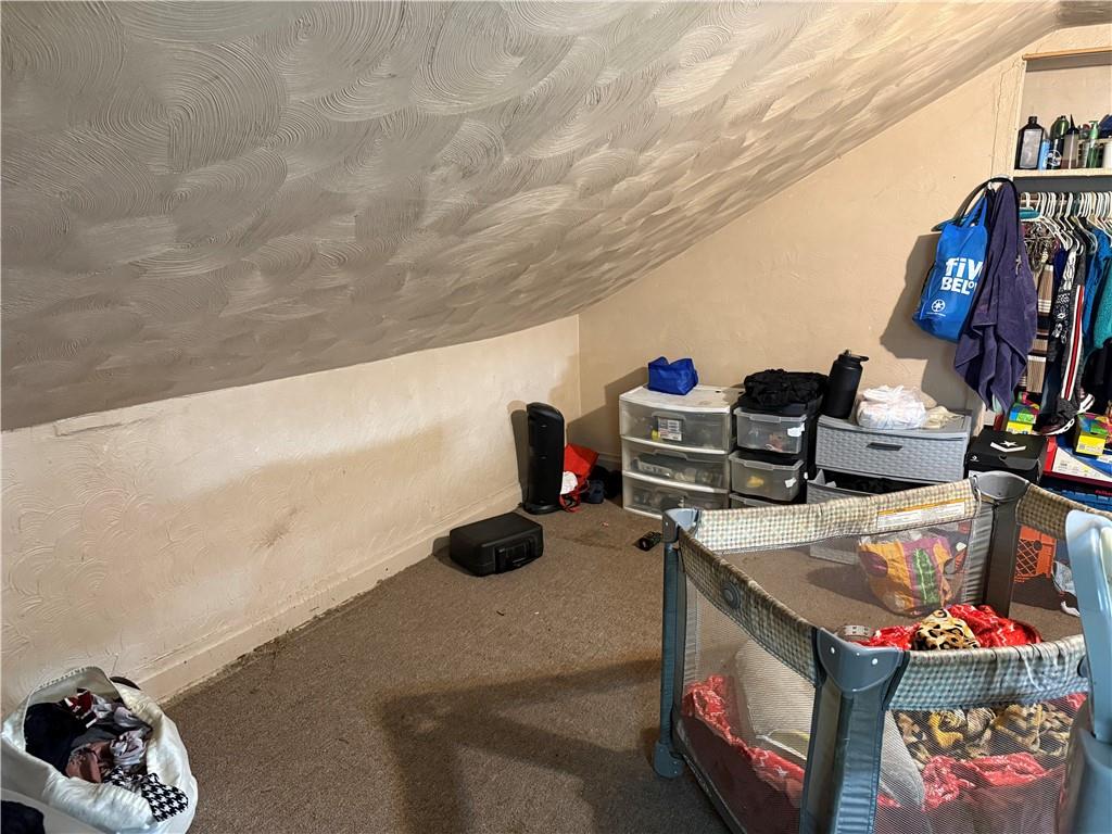 117 Charles Street Pittsburgh, PA 15210 - Photo 14 of 17 a room with toys and flowers