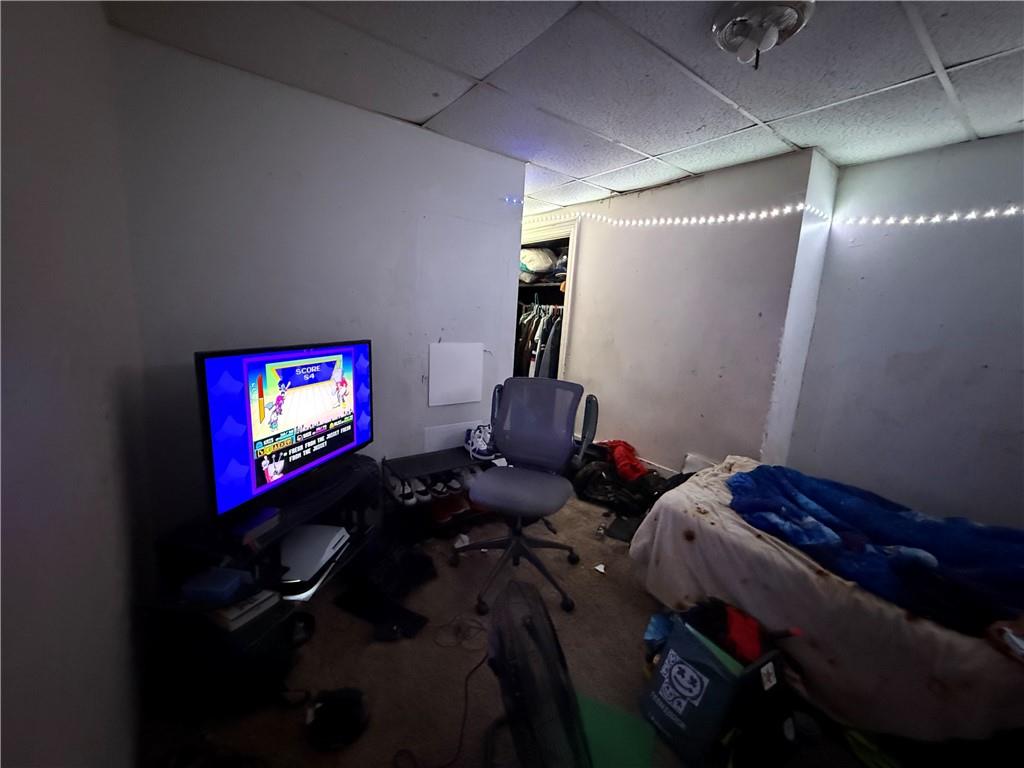 117 Charles Street Pittsburgh, PA 15210 - Photo 9 of 17 a bedroom with bed and a bookshelf